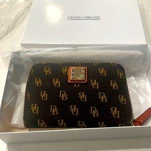 Dooney & Bourke small wallet carried a few times replaced with a larger wallet!
